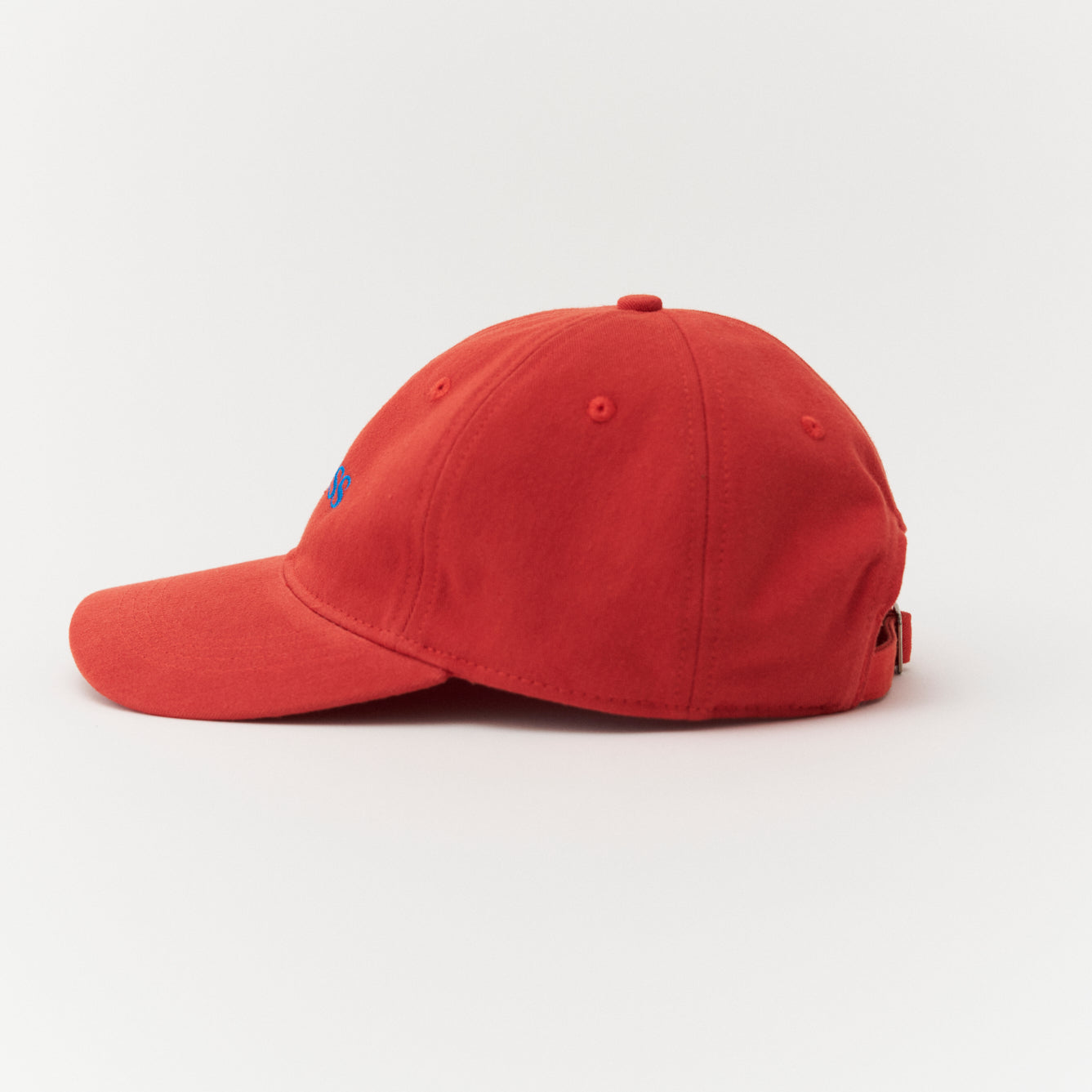Artless red cap with blue text side profile