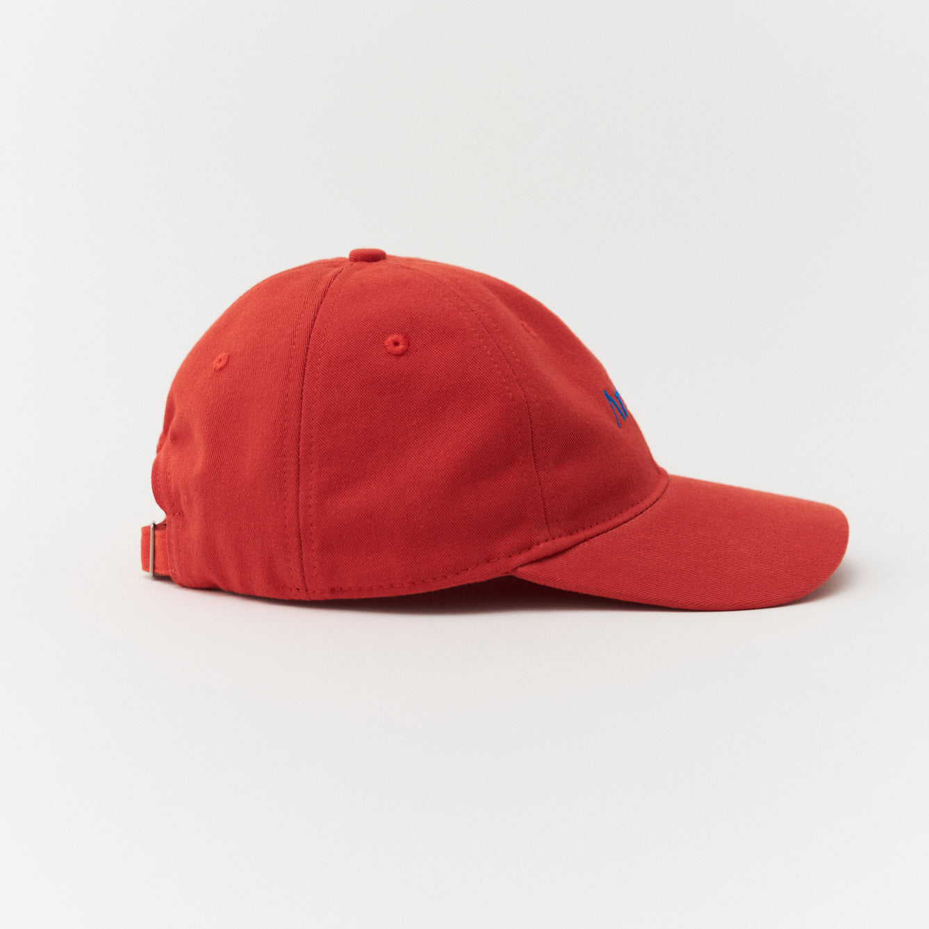 Artless red cap with blue text side profile