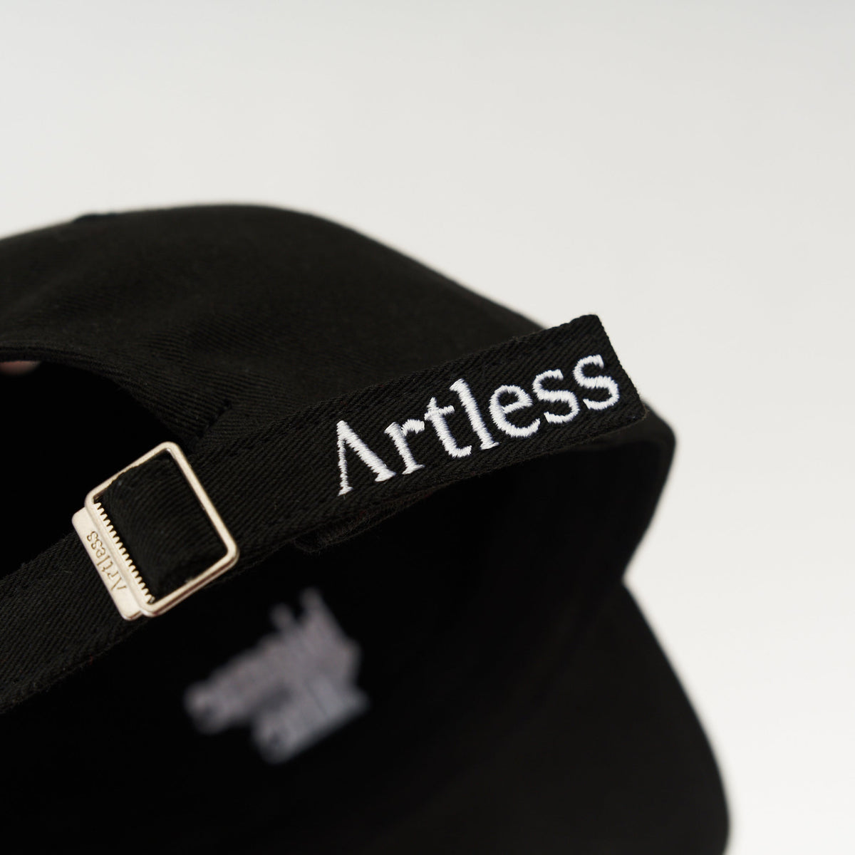 Black Artless blame the moon organic dad cap, back view with Artless strap, GOTS organic cotton
