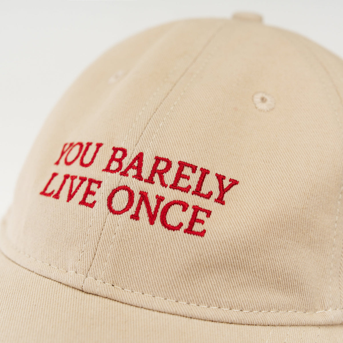 Sand Artless You Barely Live Once organic dad cap with red embroidery, front view, unstructured 6-panel GOTS organic cotton