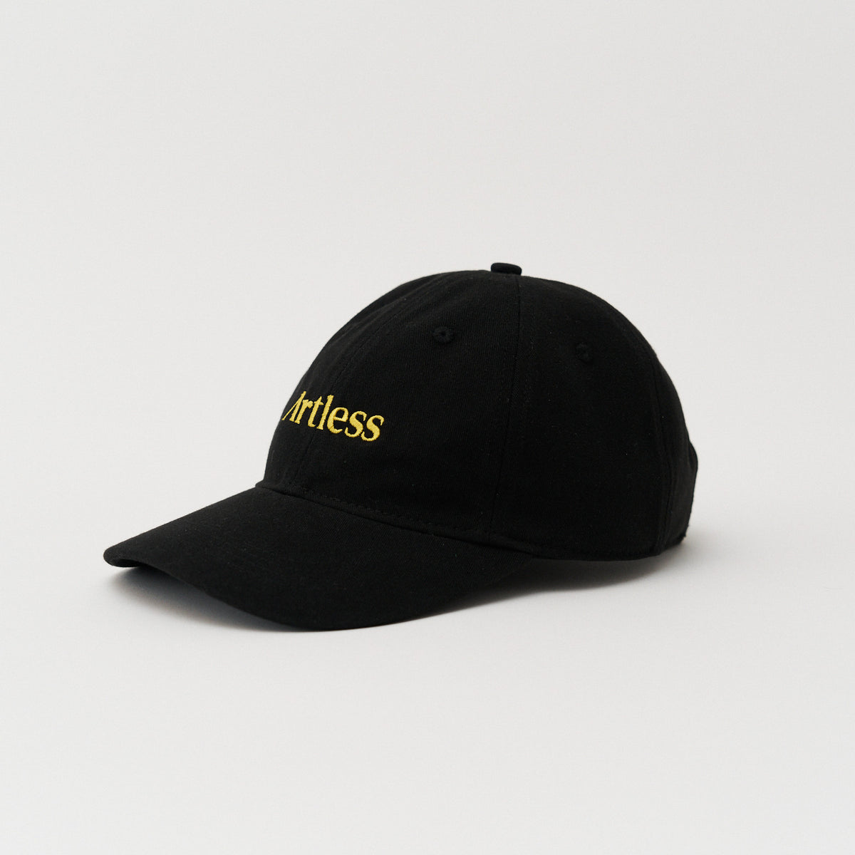 Black unstructured 6-panel dad cap made from GOTS certified organic cotton by Artless, side view