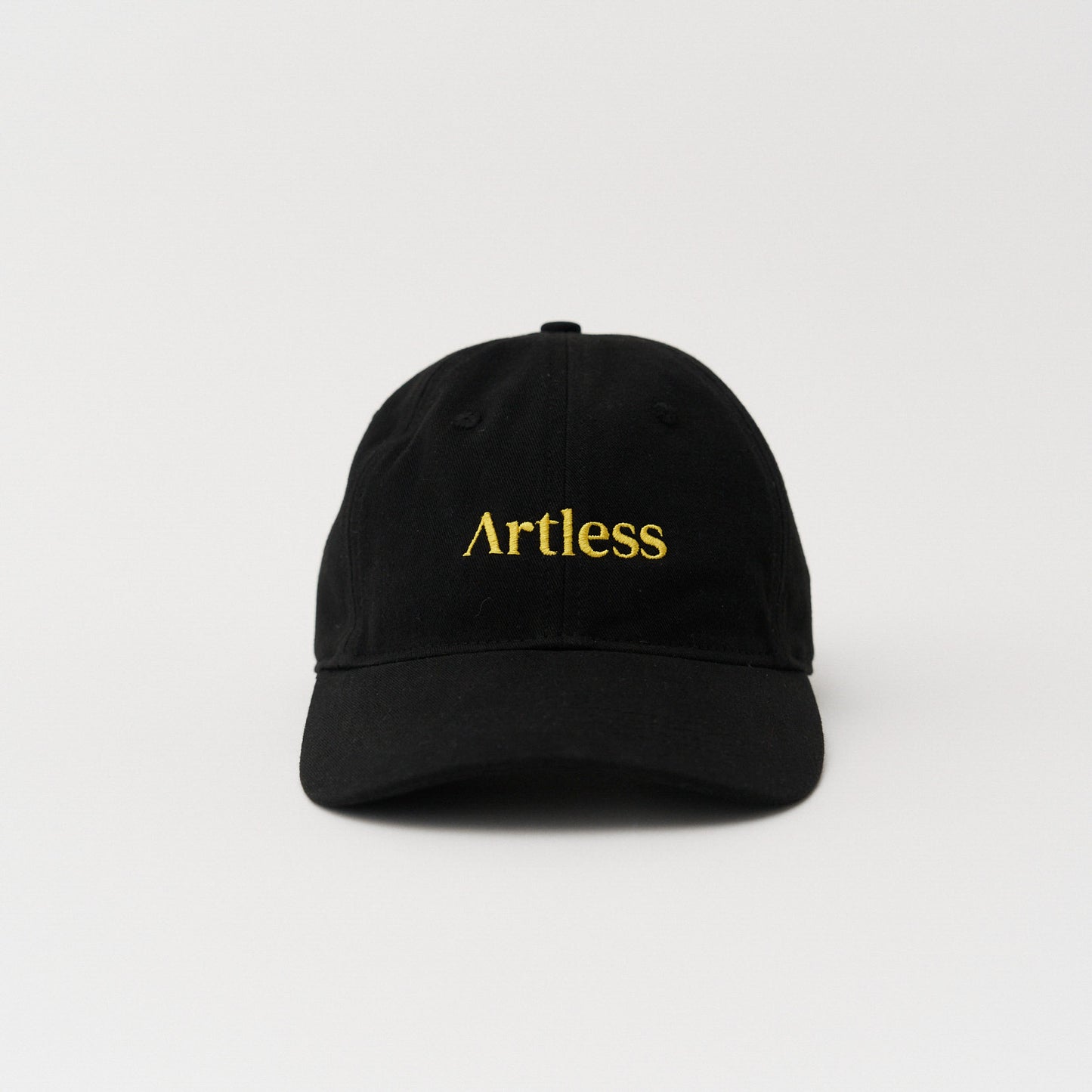 Black unstructured 6-panel dad cap made from GOTS certified organic cotton by Artless front view