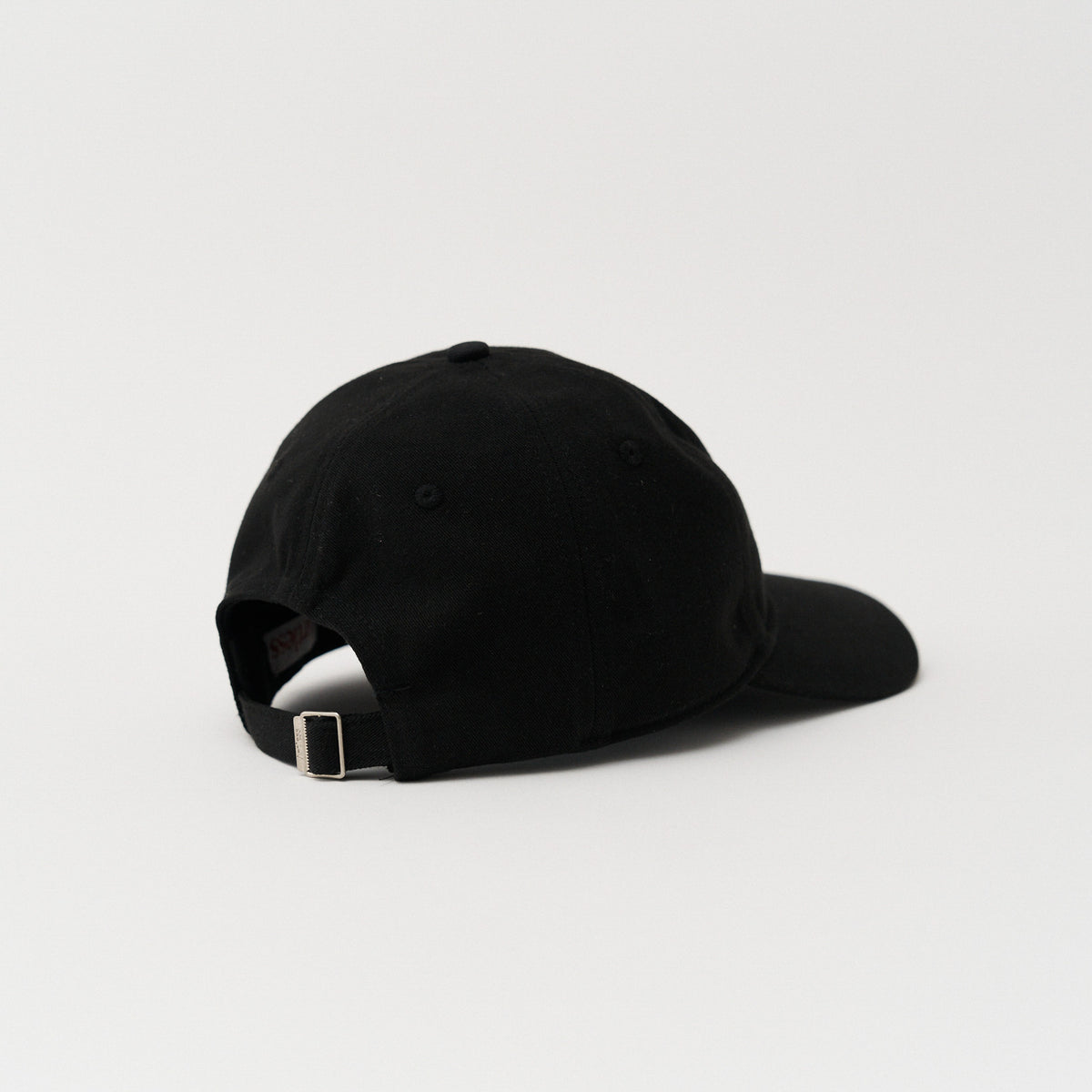 Black unstructured 6-panel dad cap made from GOTS certified organic cotton by Artless, back view