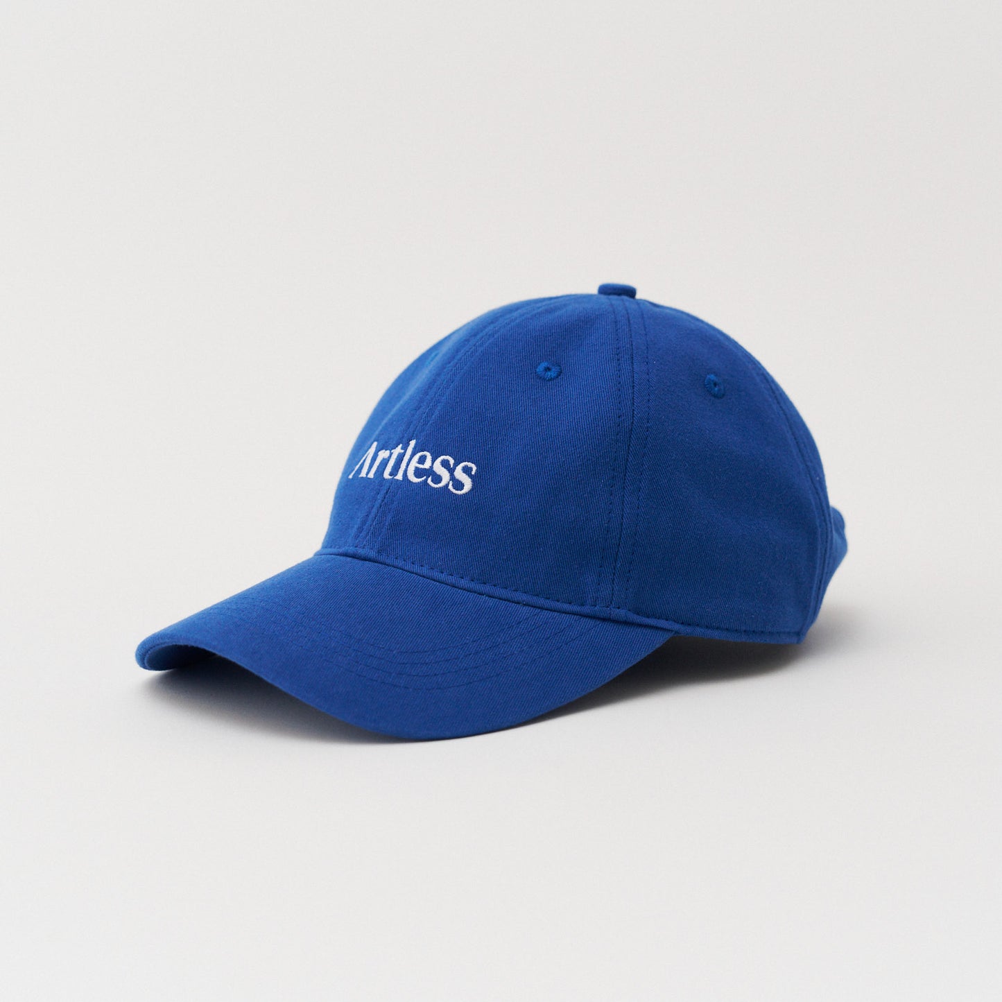 blue unstructured 6-panel dad cap made from GOTS certified organic cotton by Artless side view
