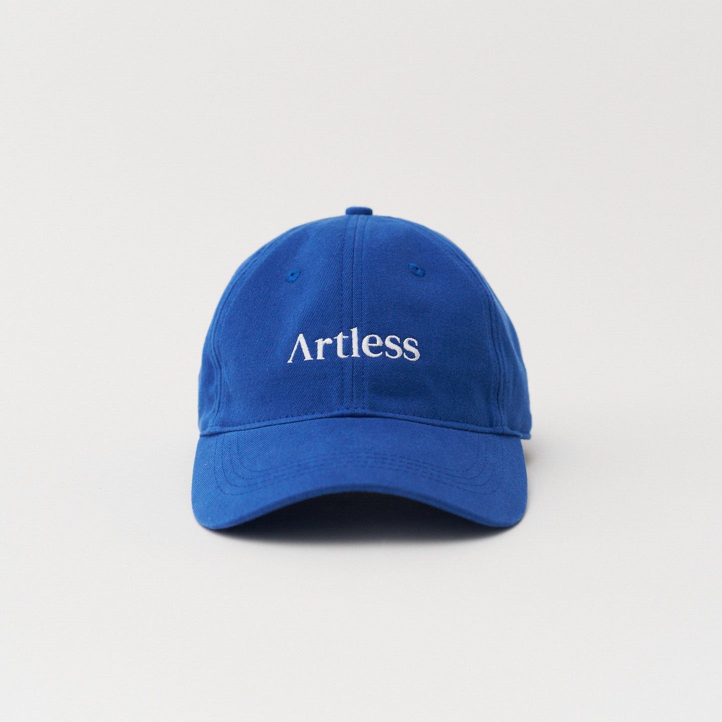 Blue unstructured 6-panel dad cap made from GOTS certified organic cotton by Artless front view