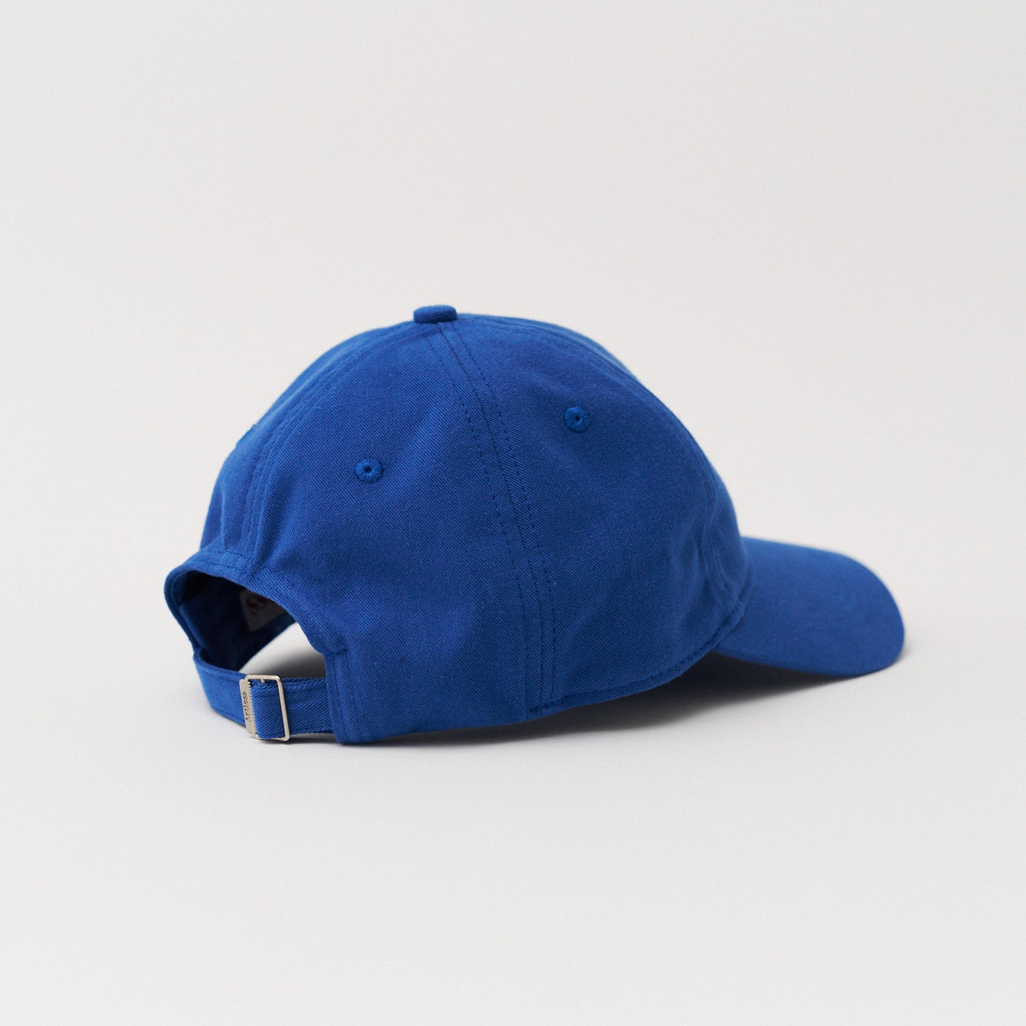 blue unstructured 6-panel dad cap made from GOTS certified organic cotton by Artless back view