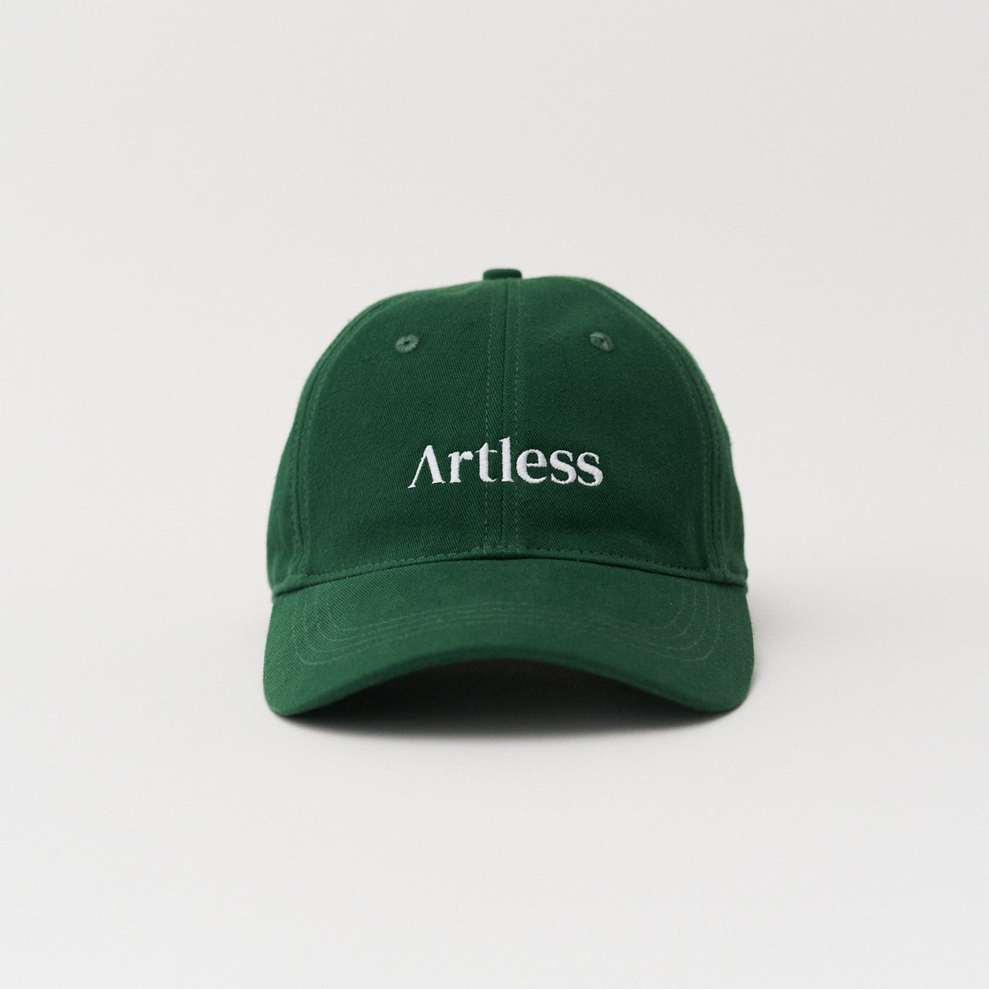 Green unstructured 6-panel dad cap made from GOTS certified organic cotton by Artless front view