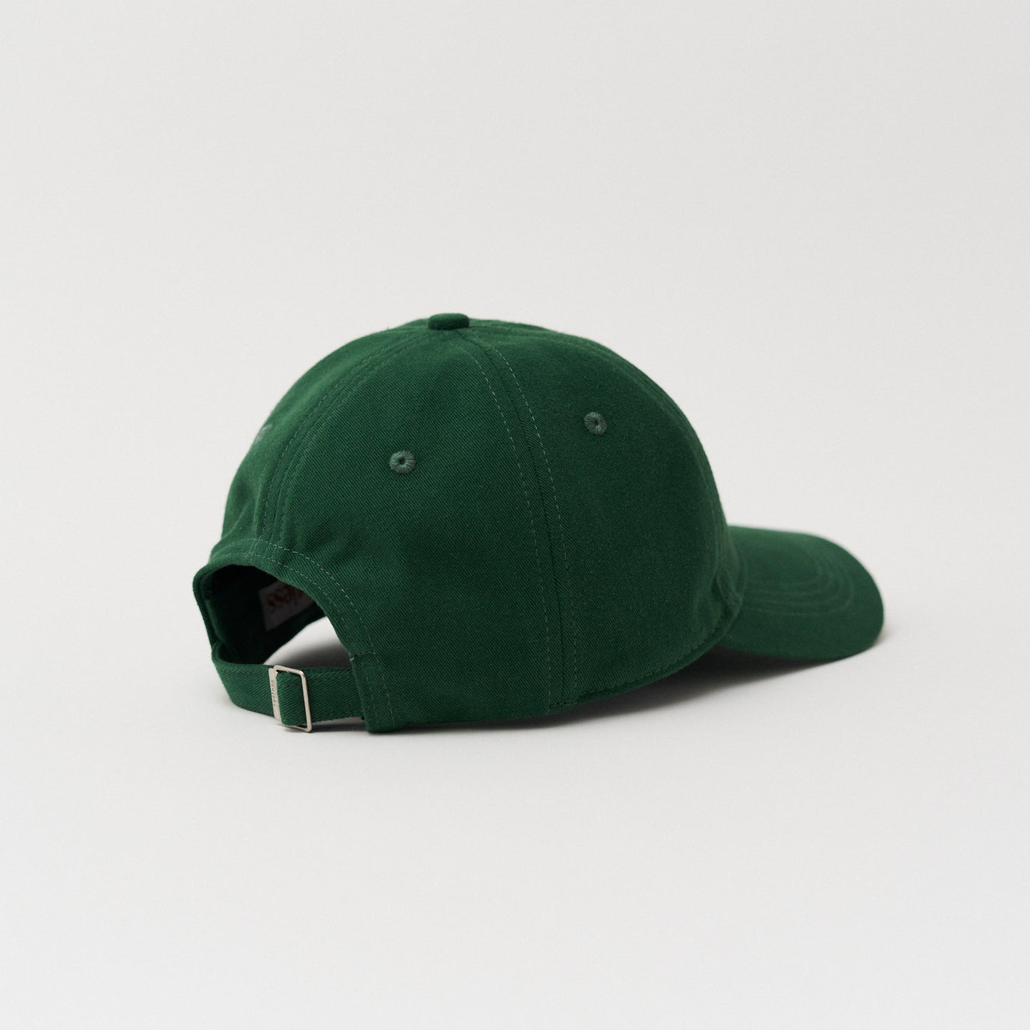 Green unstructured 6-panel dad cap made from GOTS certified organic cotton by Artless back view
