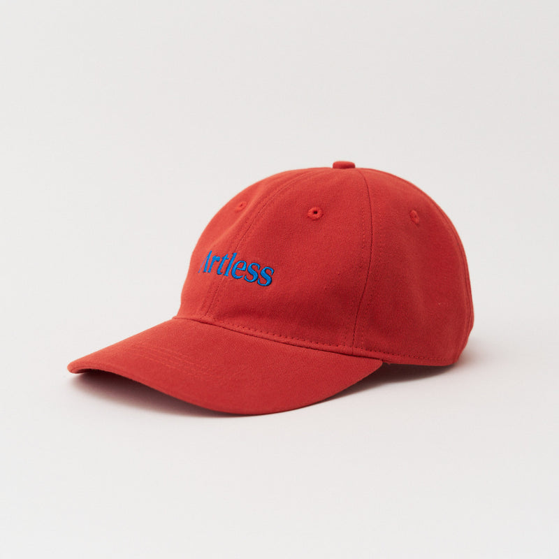 Red Artless logo dad cap with an embroidered blue logo in GOTS certified organic cotton, three quarter view