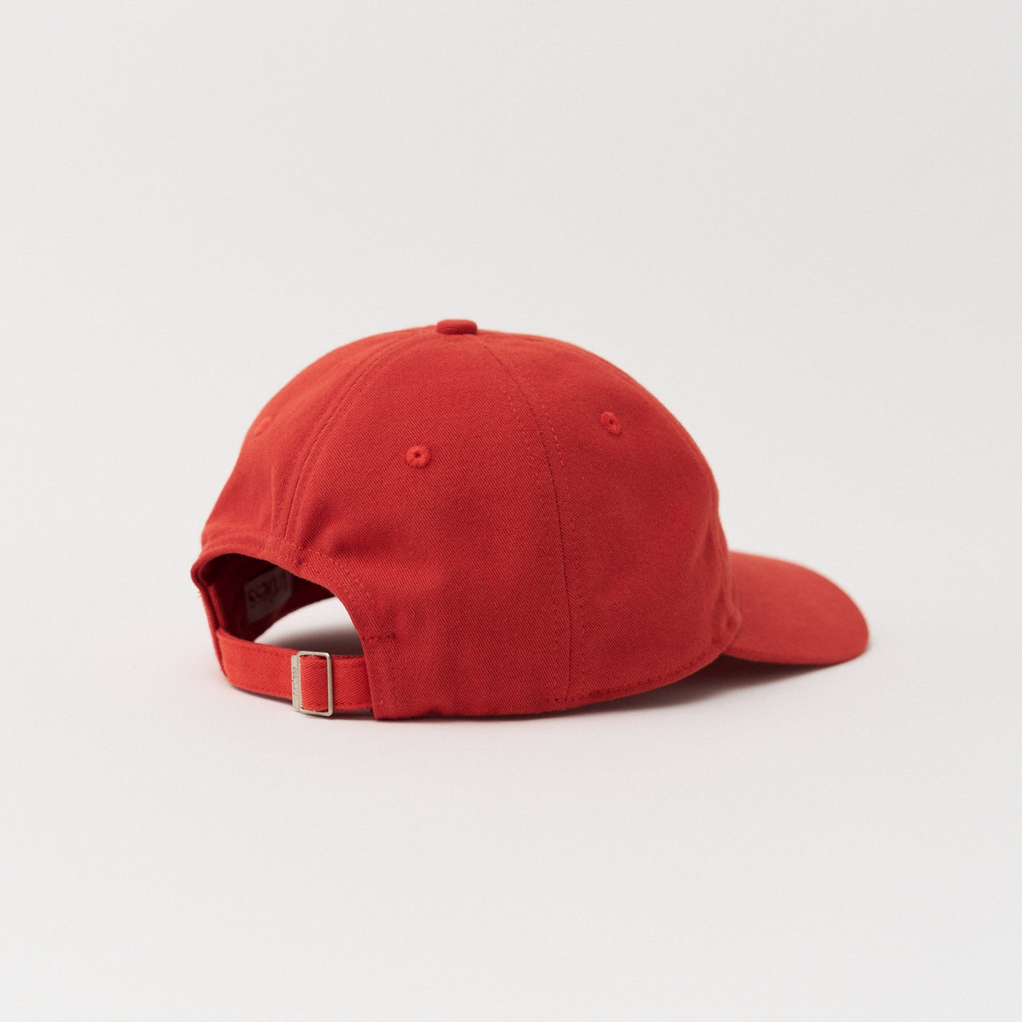 Red unstructured 6-panel dad cap made from GOTS certified organic cotton by Artless back view