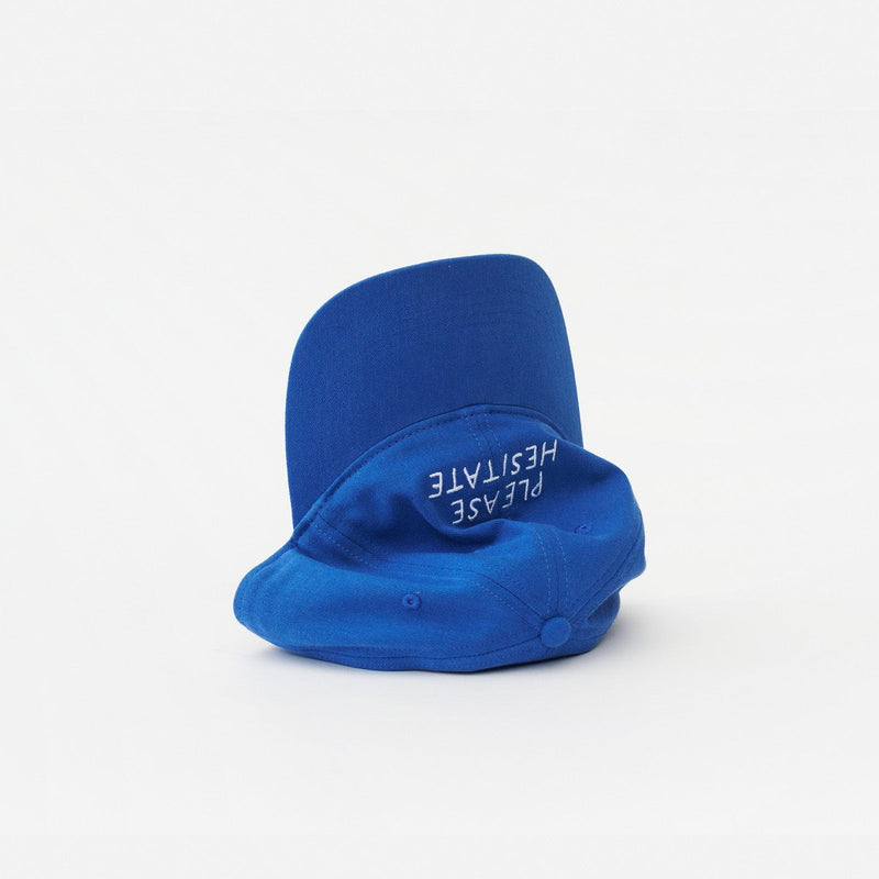 Blue Artless Please Hesitate organic dad cap, laying on its side