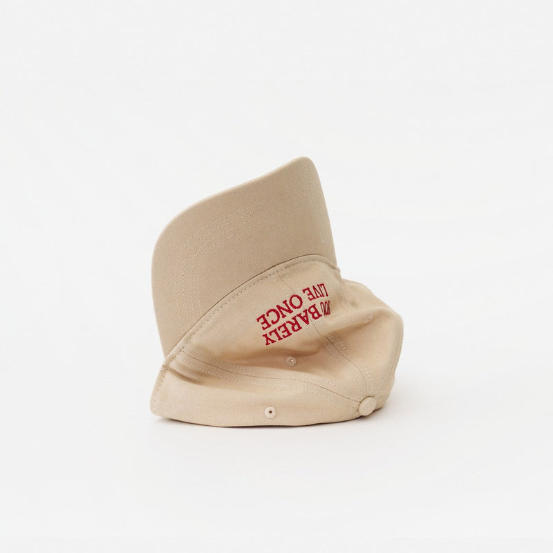 Sand Artless You Barely Live Once organic dad cap, laying on its side