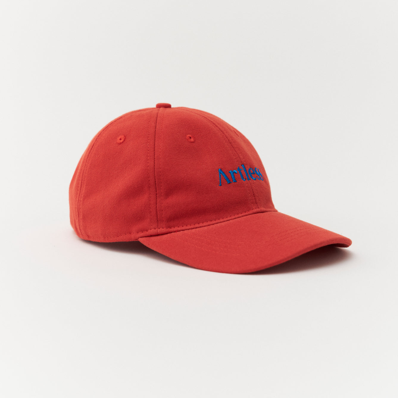 Artless red cap with blue text side profile