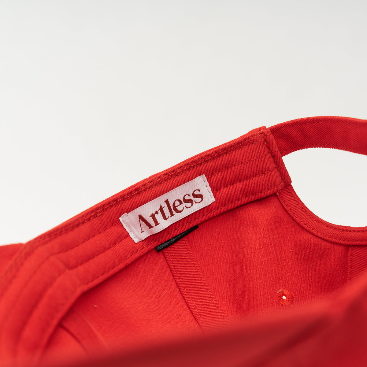Red Artless blame the moon organic dad cap with blue embroidery, side view, GOTS organic cotton