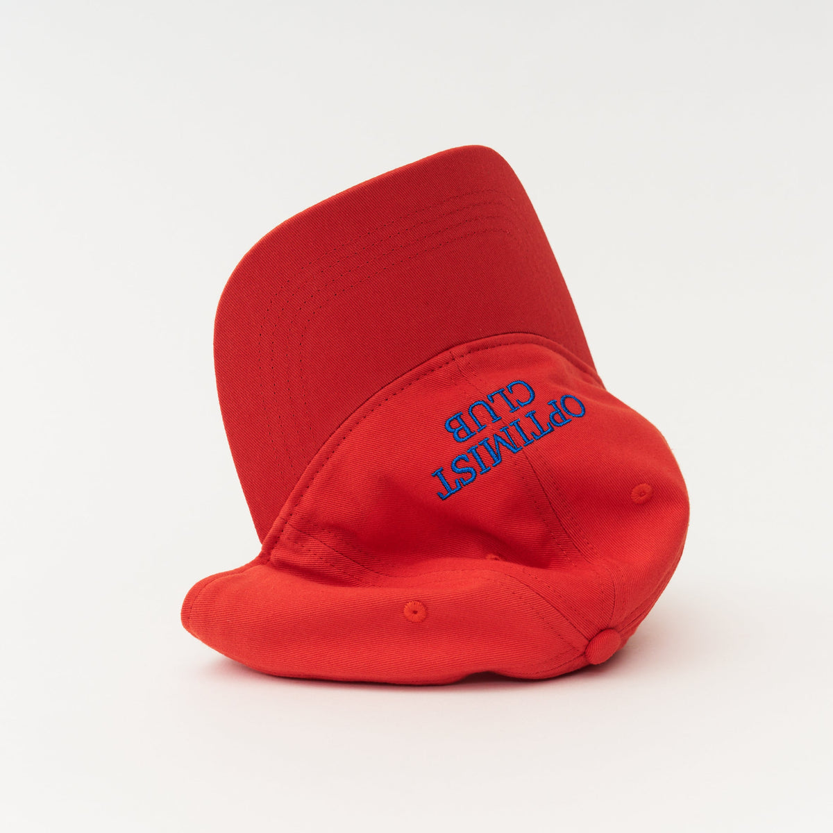 Red Artless Optimist Club organic dad cap with blue embroidery, unstructured 6-panel GOTS organic cotton