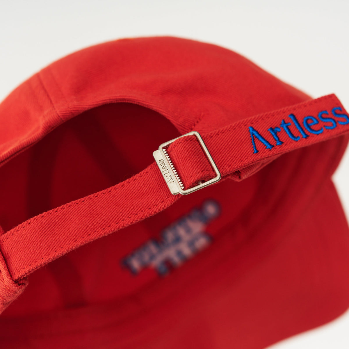 Red Artless Optimist Club organic dad cap with blue embroidery, unstructured 6-panel GOTS organic cotton