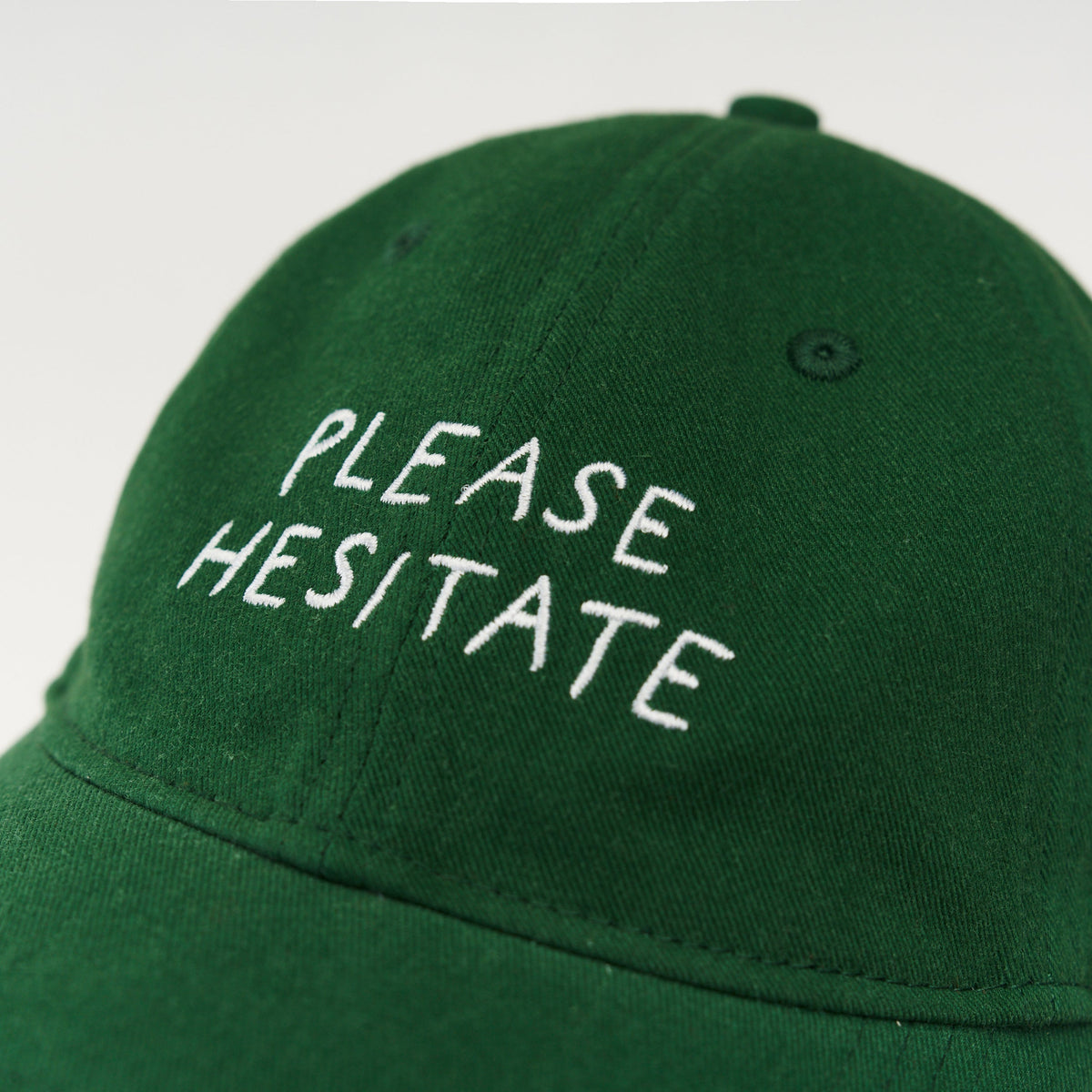Green Artless Please Hesitate organic dad cap, front view, unstructured 6-panel GOTS organic cotton