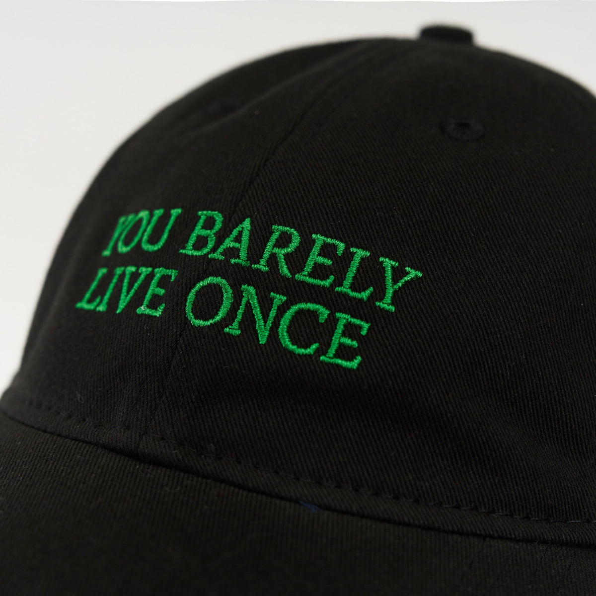 Black Artless You Barely Live Once organic dad cap with green embroidery, unstructured 6-panel GOTS organic cotton