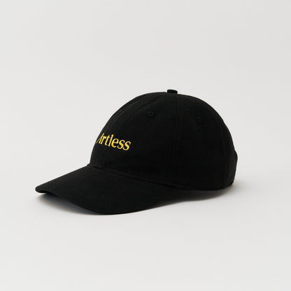 black Close up of the embroidery of a green unstructured 6-panel dad cap made from GOTS certified organic cotton by Artless side view