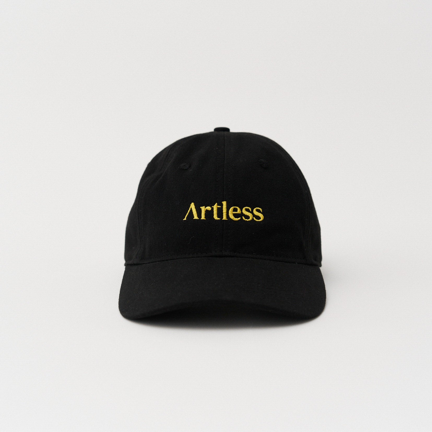 Black unstructured 6-panel dad cap made from GOTS certified organic cotton by Artless front view