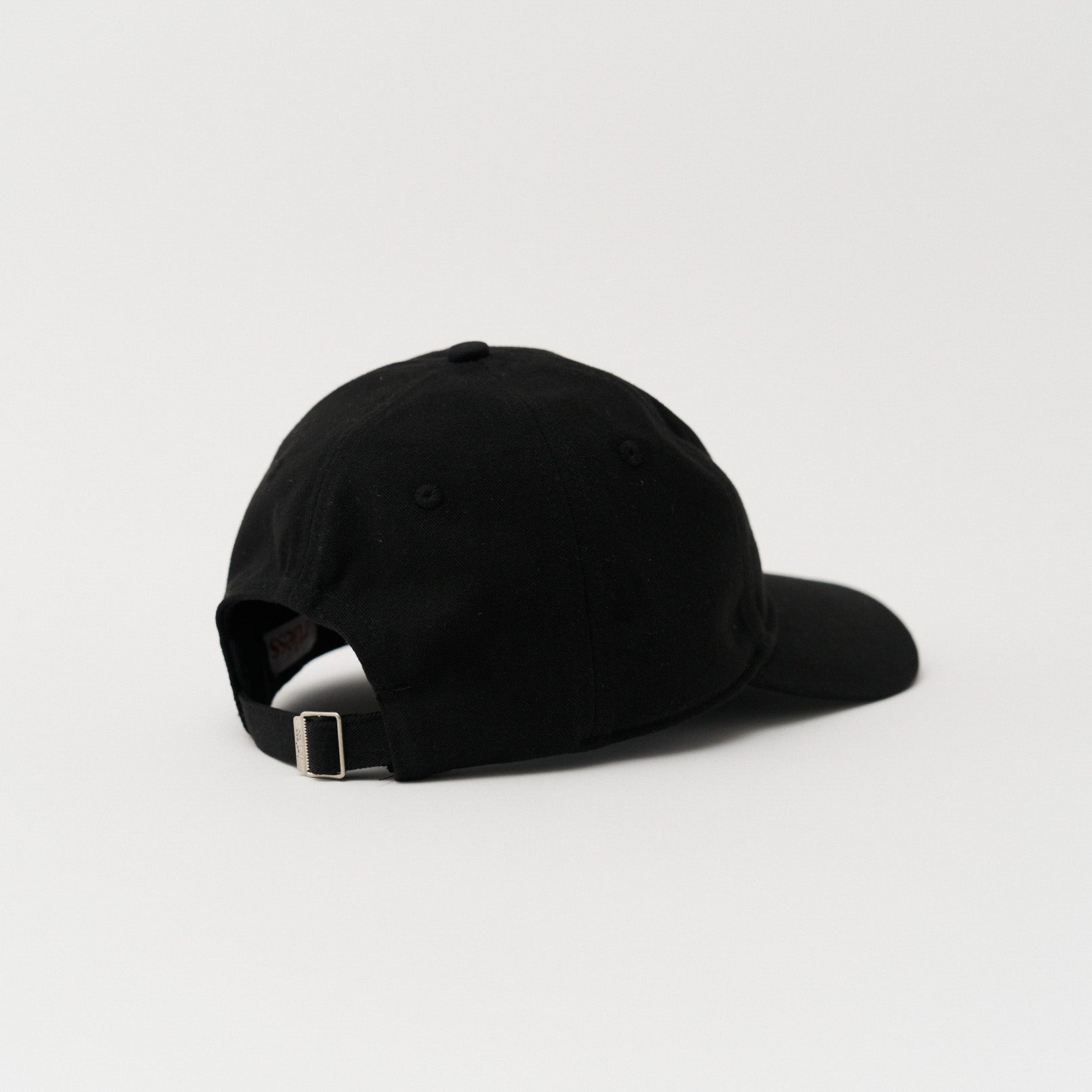 black Close up of the embroidery of a green unstructured 6-panel dad cap made from GOTS certified organic cotton by Artless back view