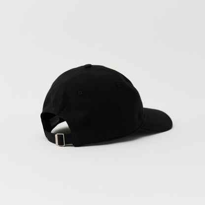 black Close up of the embroidery of a green unstructured 6-panel dad cap made from GOTS certified organic cotton by Artless back view