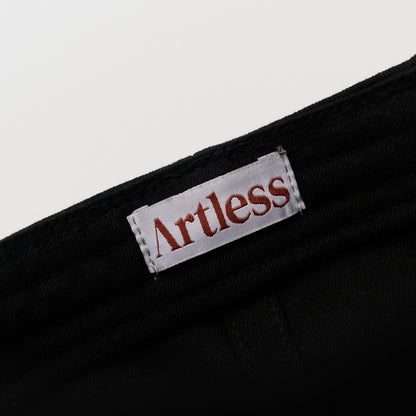 Artless label in a black unstructured 6-panel dad cap made from GOTS certified organic cotton 