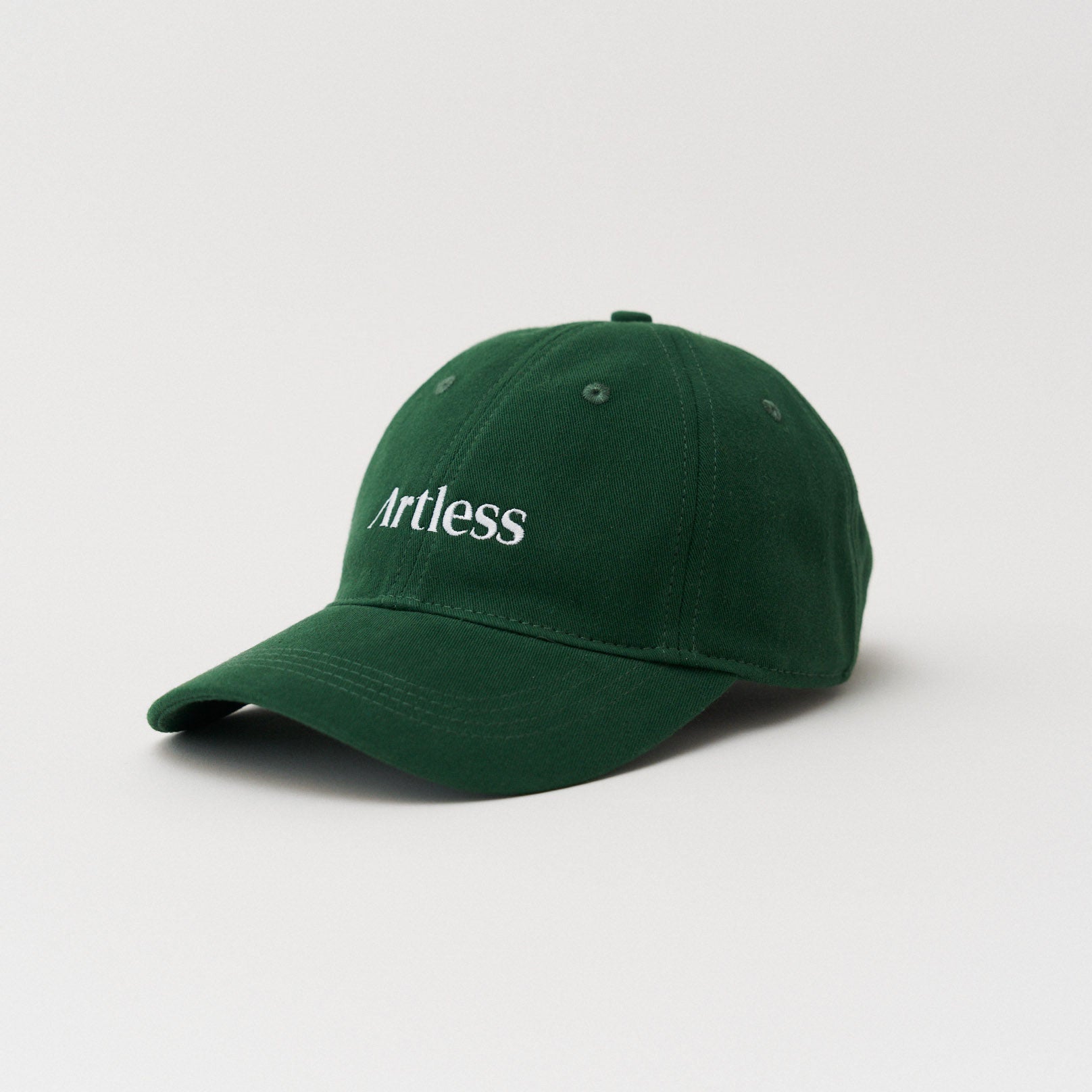 green unstructured 6-panel dad cap made from GOTS certified organic cotton by Artless